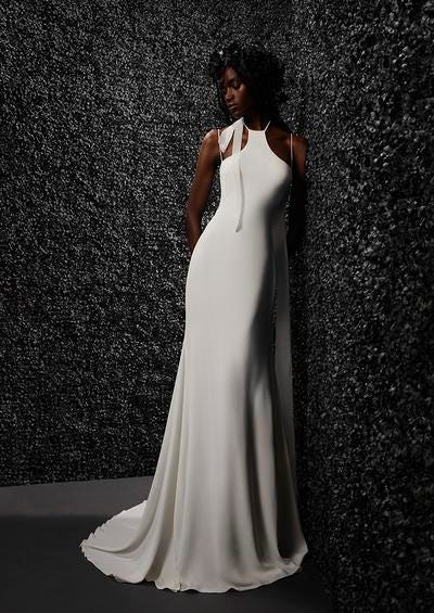 woman wearing a sheath crepe wedding dress with halter neck 