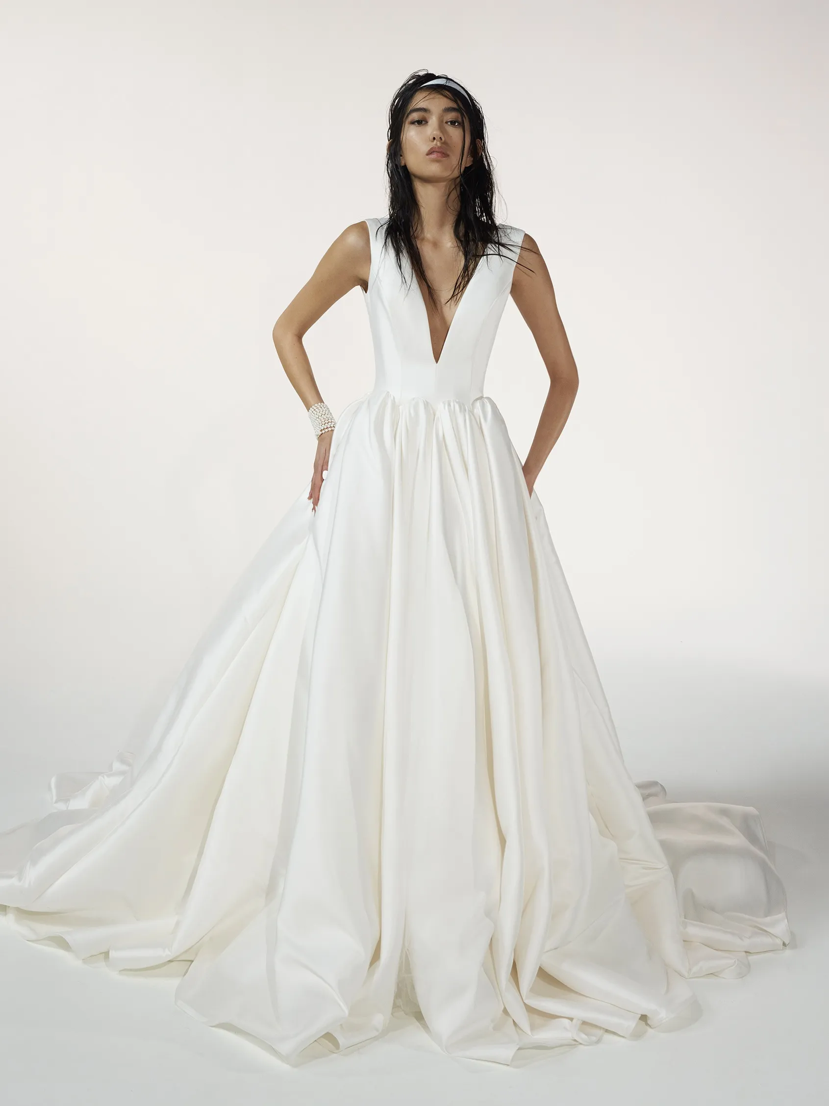 woman wearing a sleeveless princess-cut wedding dress with V-neck